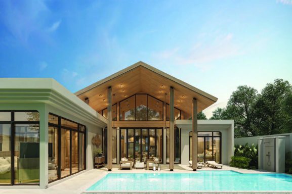 Maison moderne avec piscine, toit en pente et grandes baies vitrées au crépuscule.