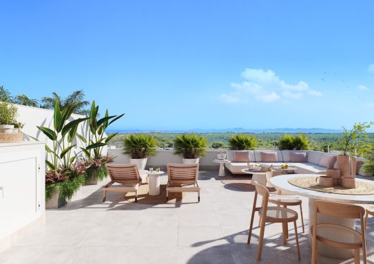 Terrasse spacieuse avec chaises longues, table et vue panoramique sur la mer.